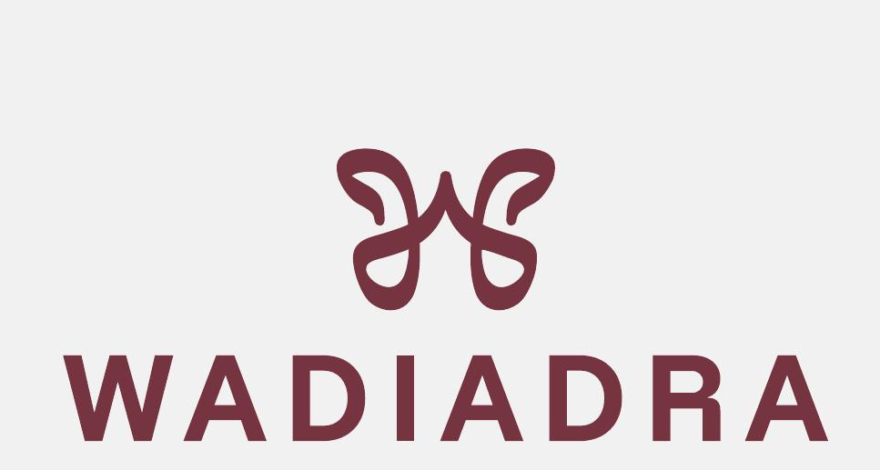 Refined Wadi Adra monogram with WADIADRA wordmark in deep maroon